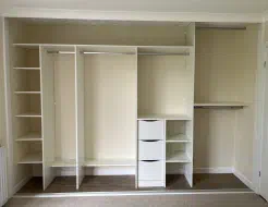 White wardrobe interior with shelving, full length hanging, drawers and extra long double hanging, fitted in Ellerby